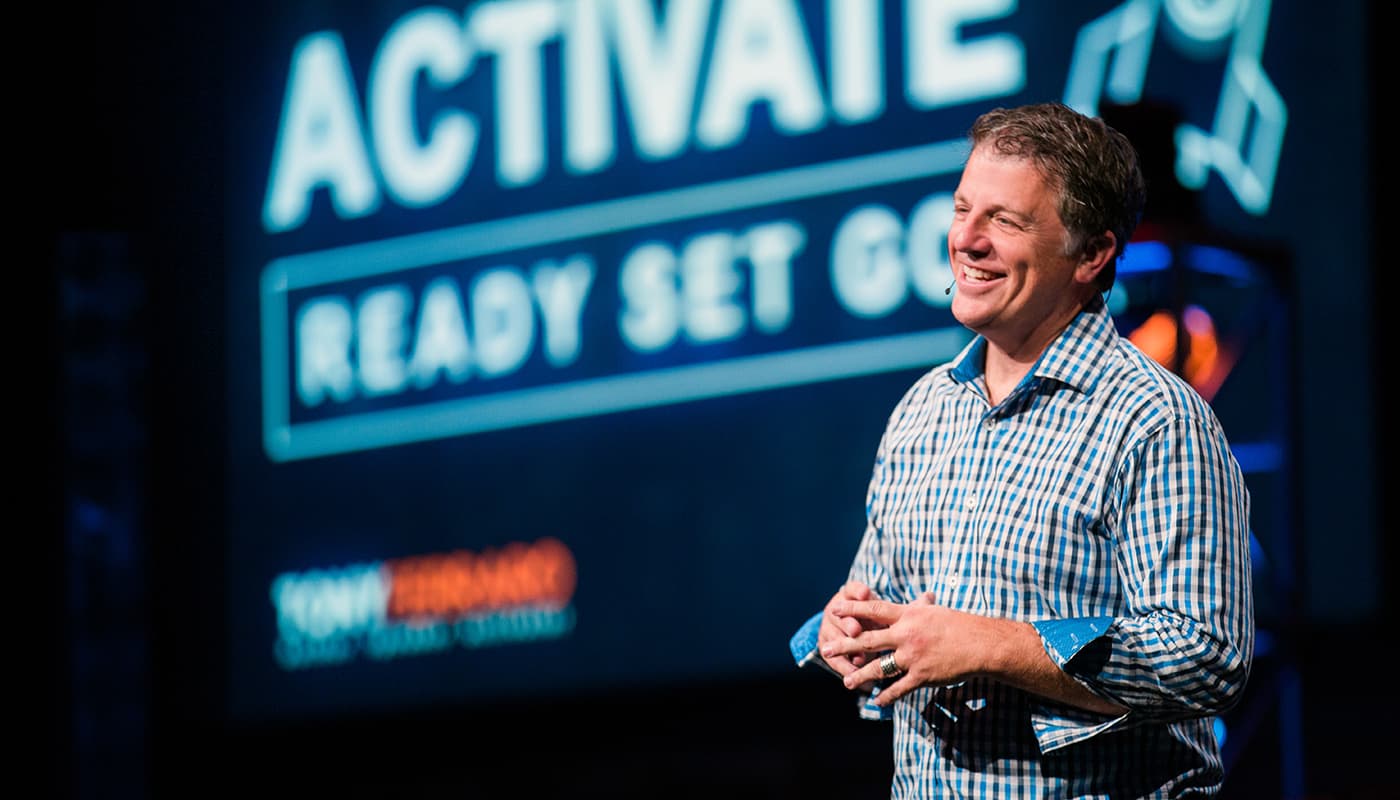 Tony Ferraro speaking on stage